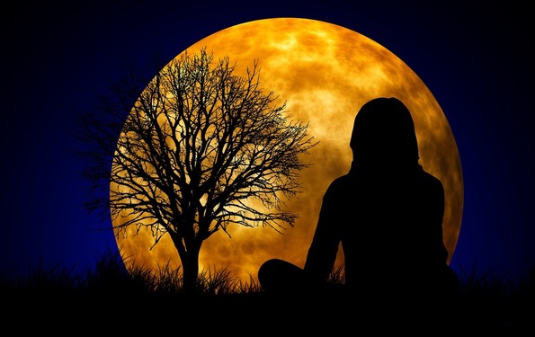Shadow of a meditating Woman and a Tree in the Far meditating in front of the rising Full moon - Full Moon ANGEL ENERGIES